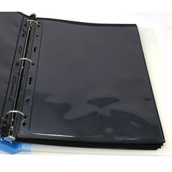 50 used black stock sheets in 2 binders