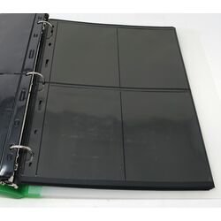 50 used black stock sheets in 2 binders